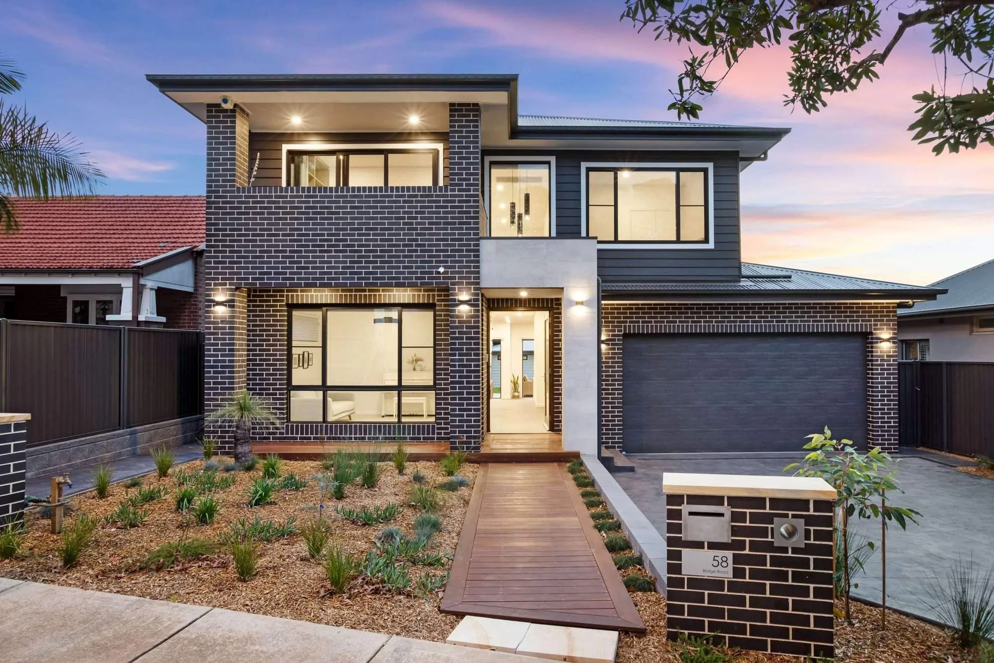 Westmead custom home and granny flat at dusk, built by Refined Group