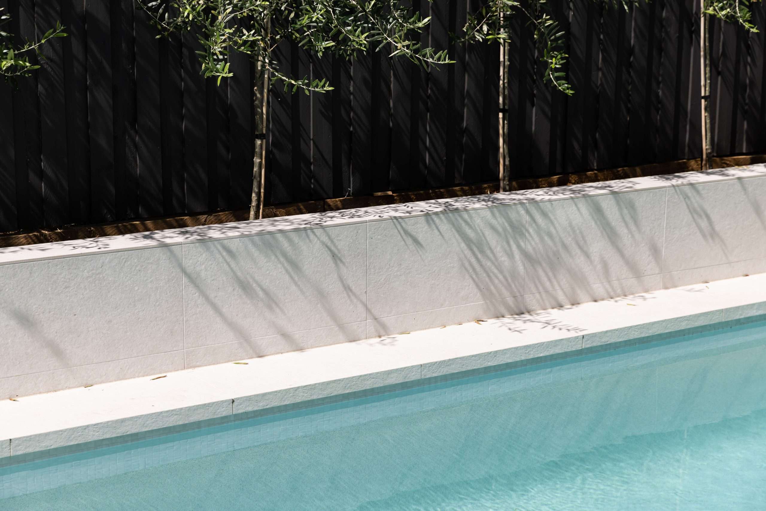 In-ground swimming pool with stone coping, Kellyville project
