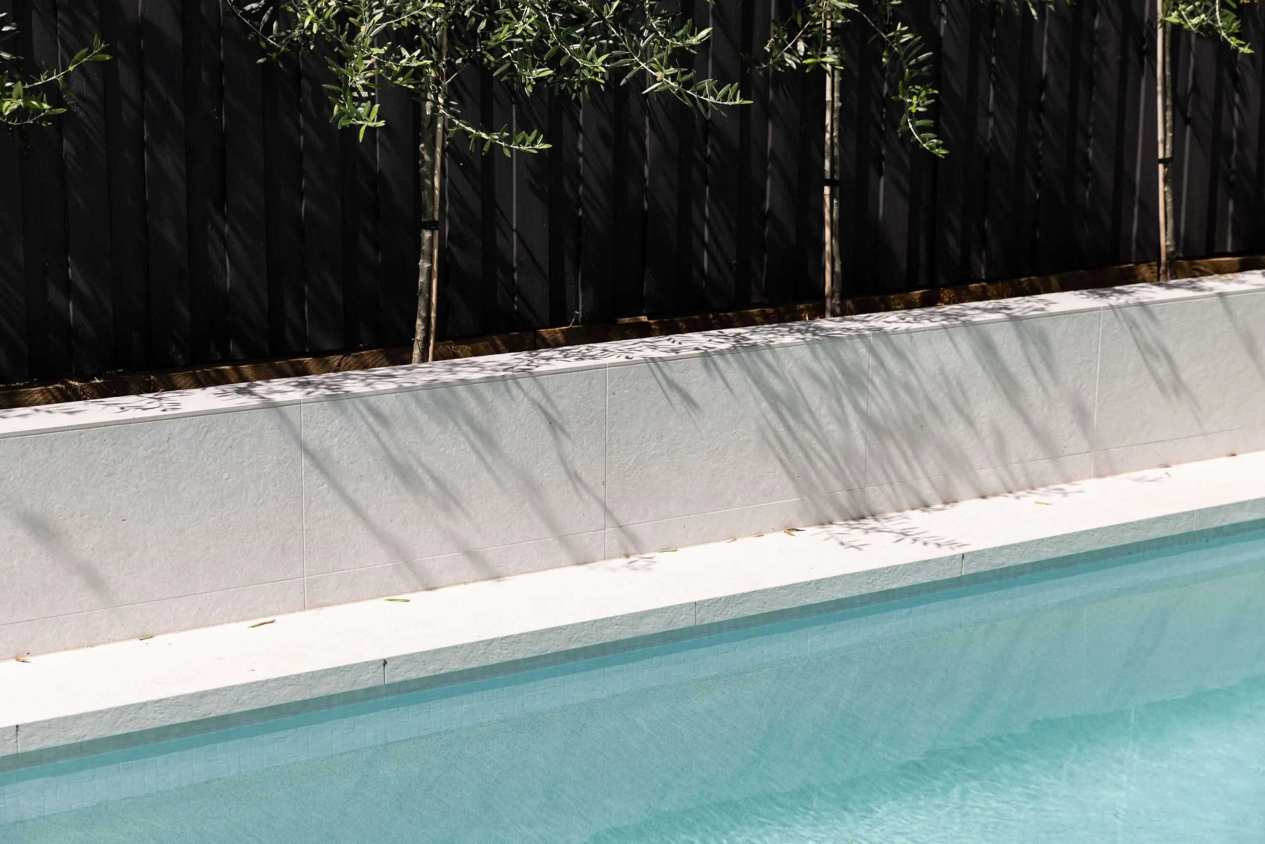In-ground swimming pool with stone coping, Kellyville project