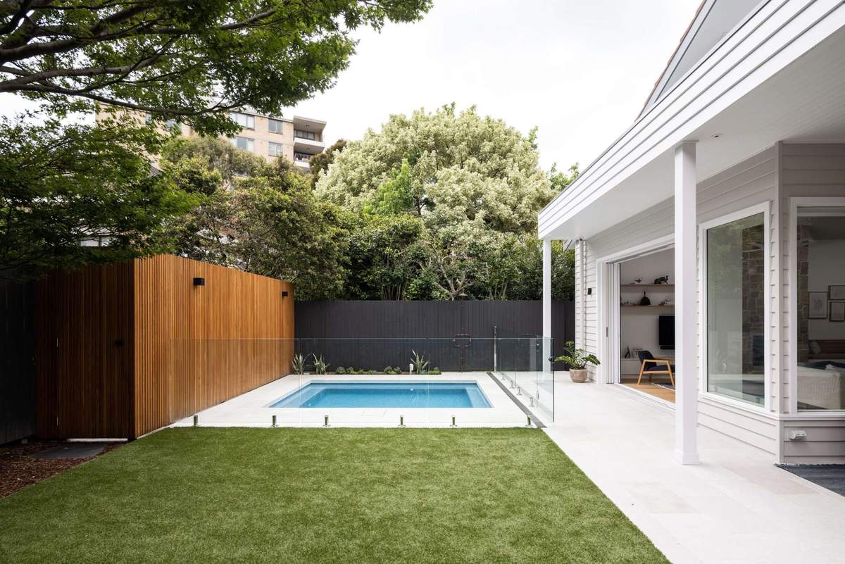 Fully tiled pool and landscape beside heritage Mosman home