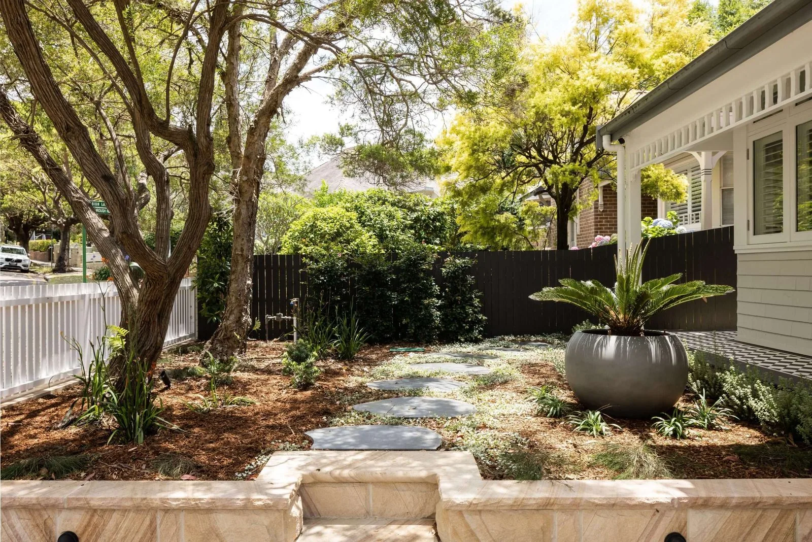 Landscaped front garden with sandstone retaining, stepping stones and native planting, Mosman | Refined Group