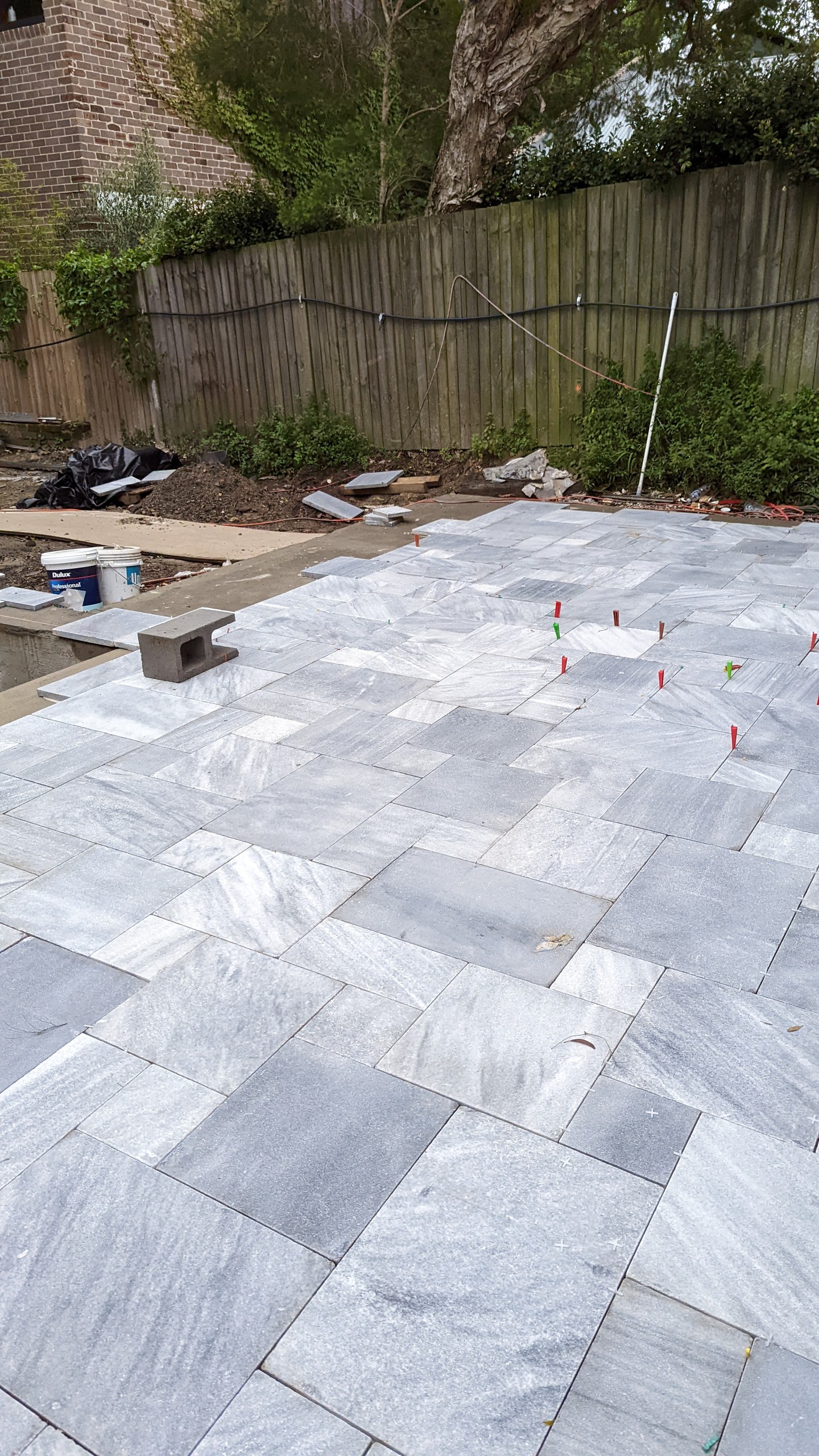 Crystal grey marble paving being laid around the pool, Balmain