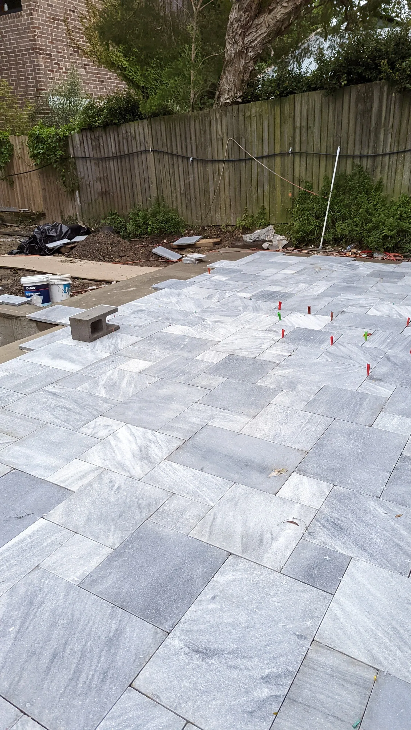 Crystal grey marble paving being laid around the pool, Balmain
