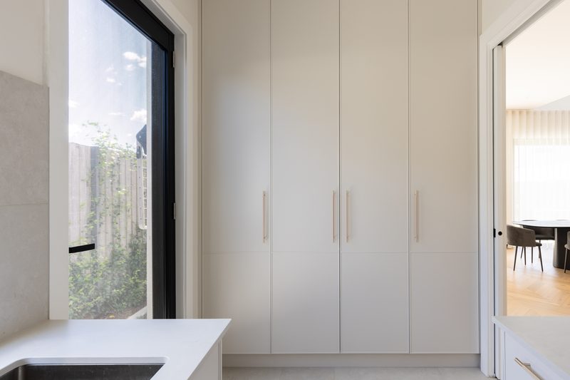 Laundry with full-height cabinetry and garden window, Kellyville custom home