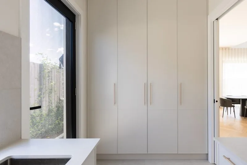 Laundry with full-height cabinetry and garden window, Kellyville custom home