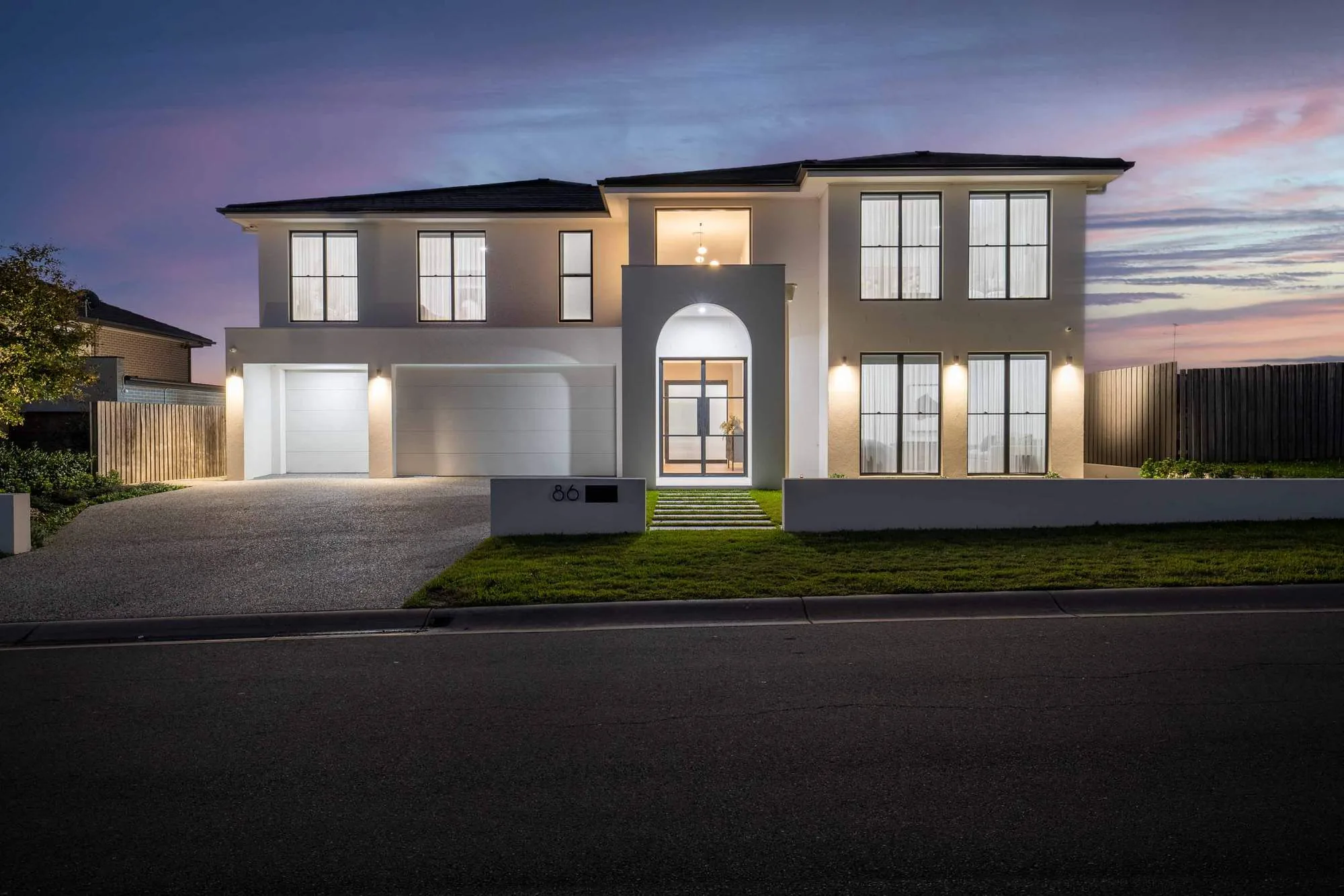 Kellyville architect-designed custom home at dusk