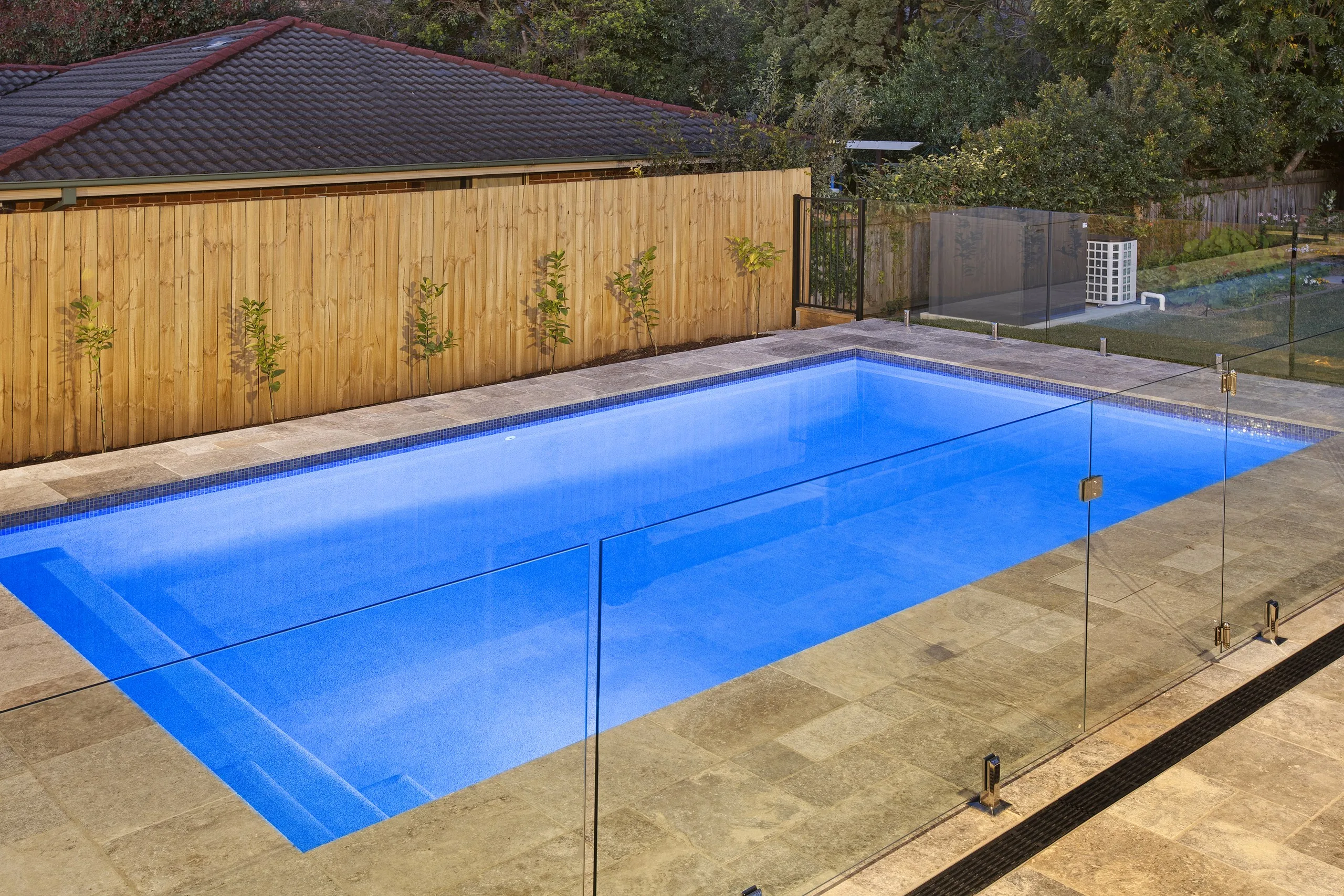 Elevated view of the concrete pool and travertine paving, Pennant Hills