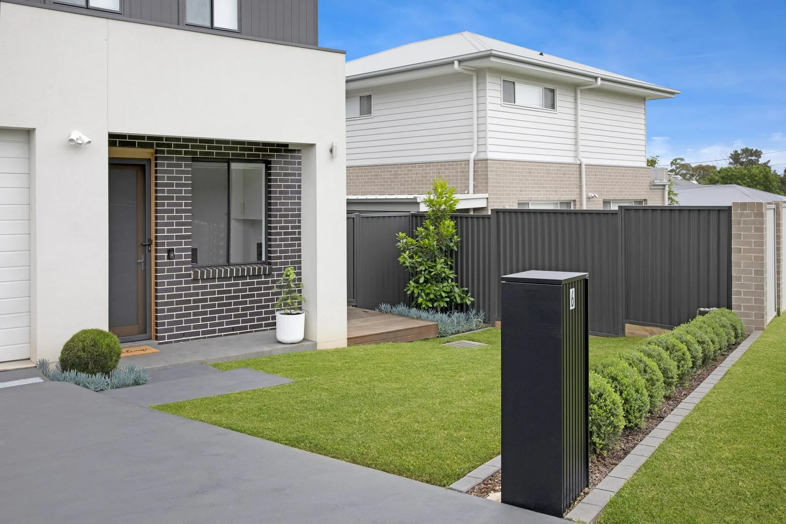 Landscaped entry garden of a Refined Group home