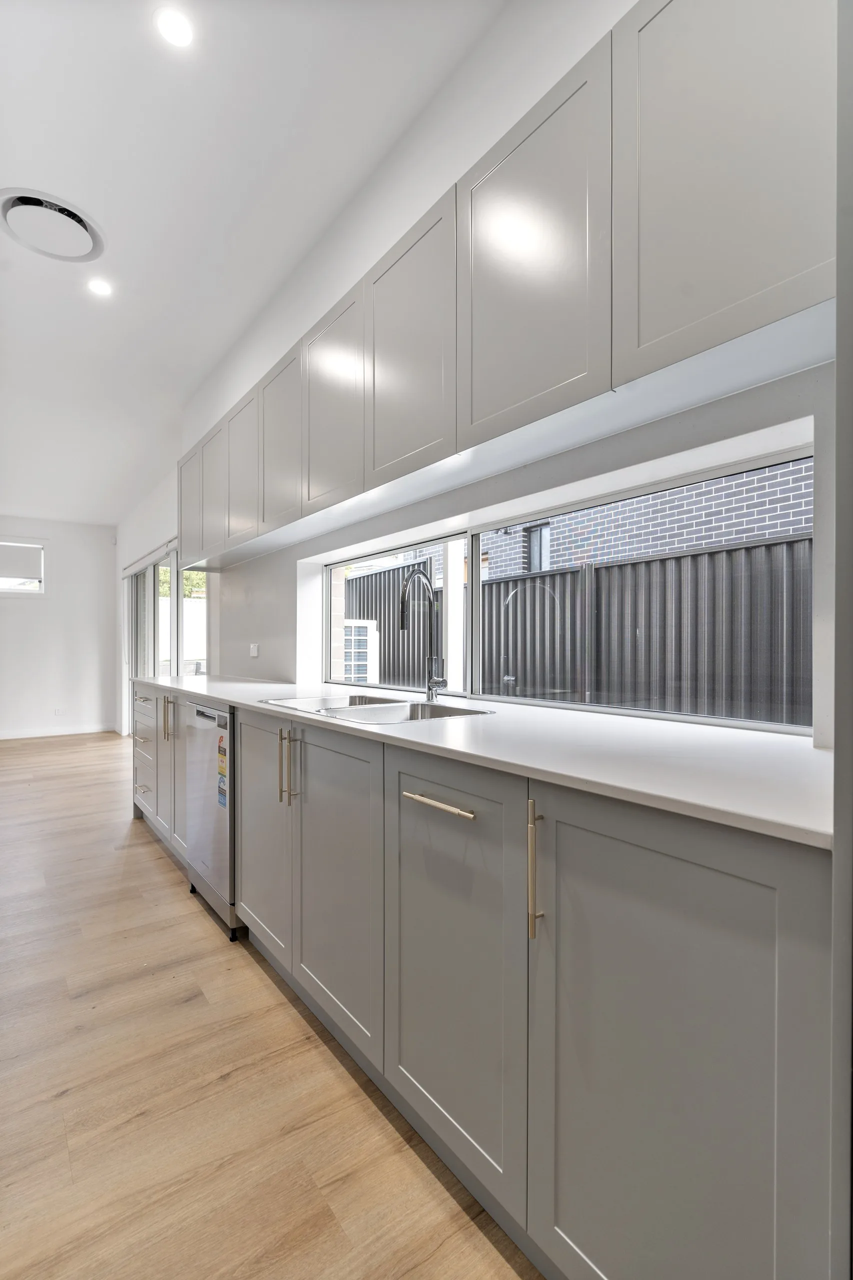Light-filled galley kitchen in the second Seven Hills home