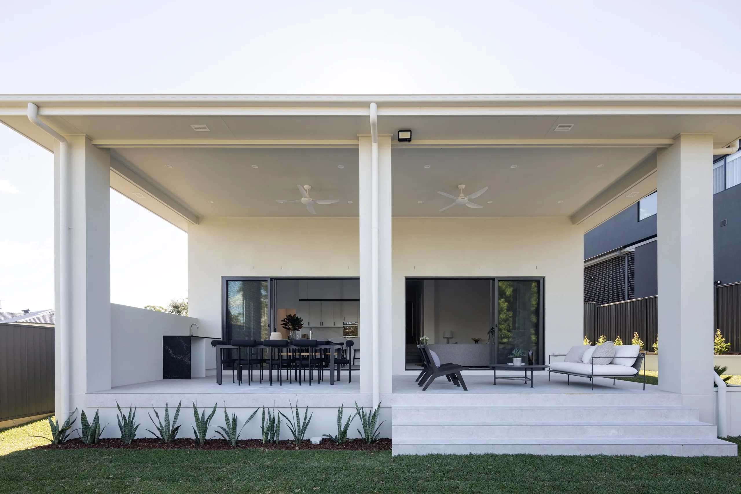Covered alfresco with outdoor dining, Westleigh split-level home