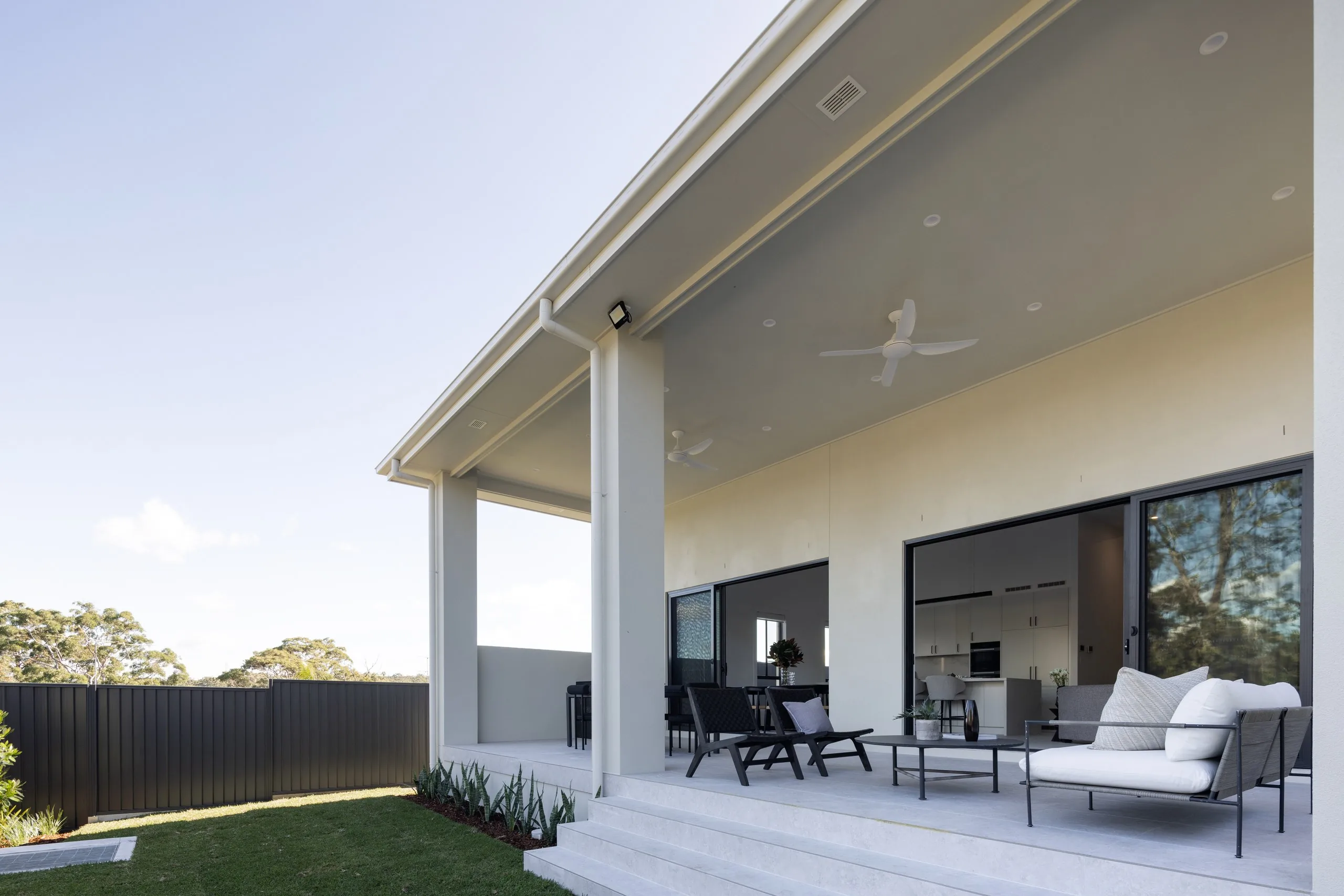 Level backyard lawn carved from the sloping block, Westleigh