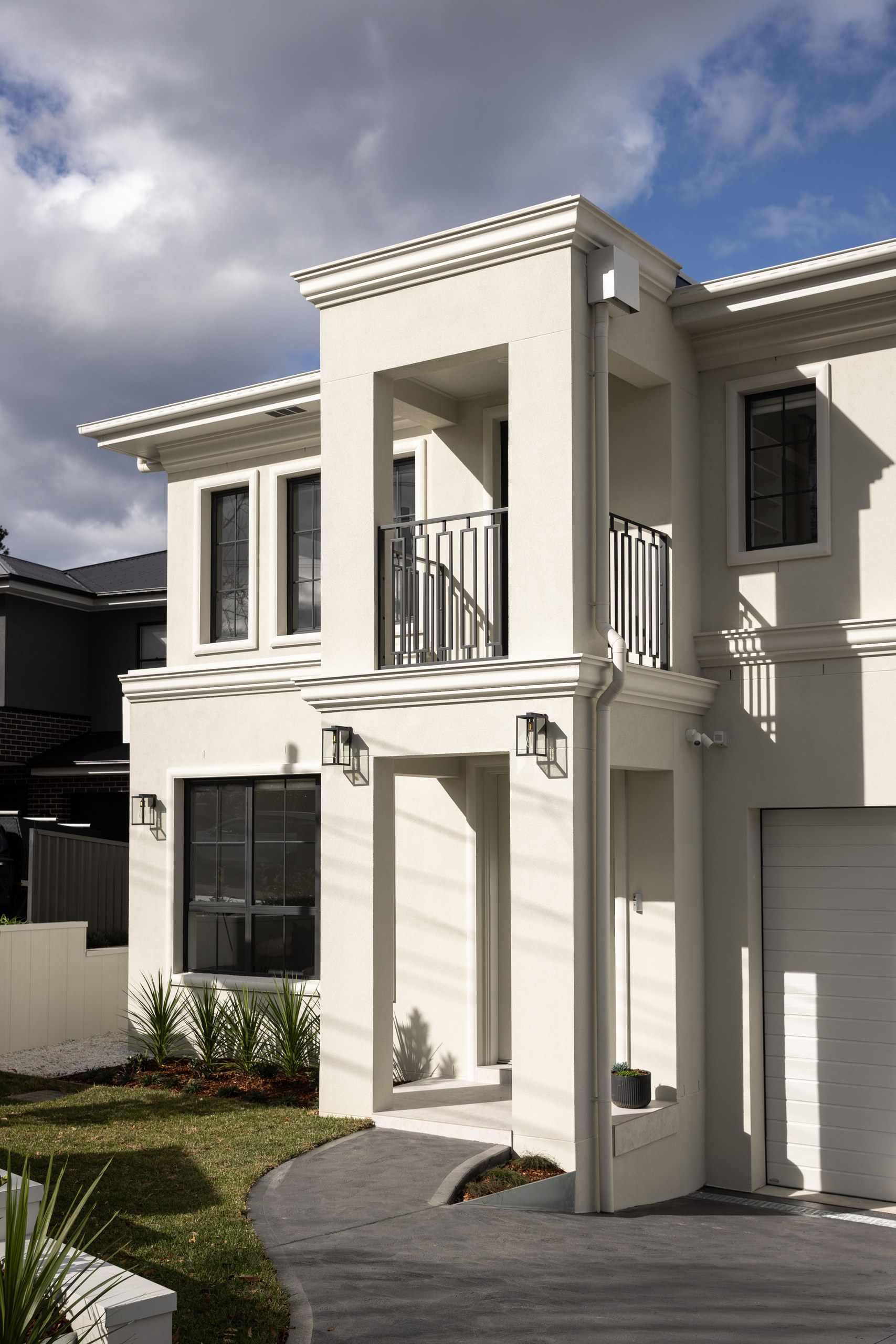 Entry and arched balcony detail, Westleigh custom home