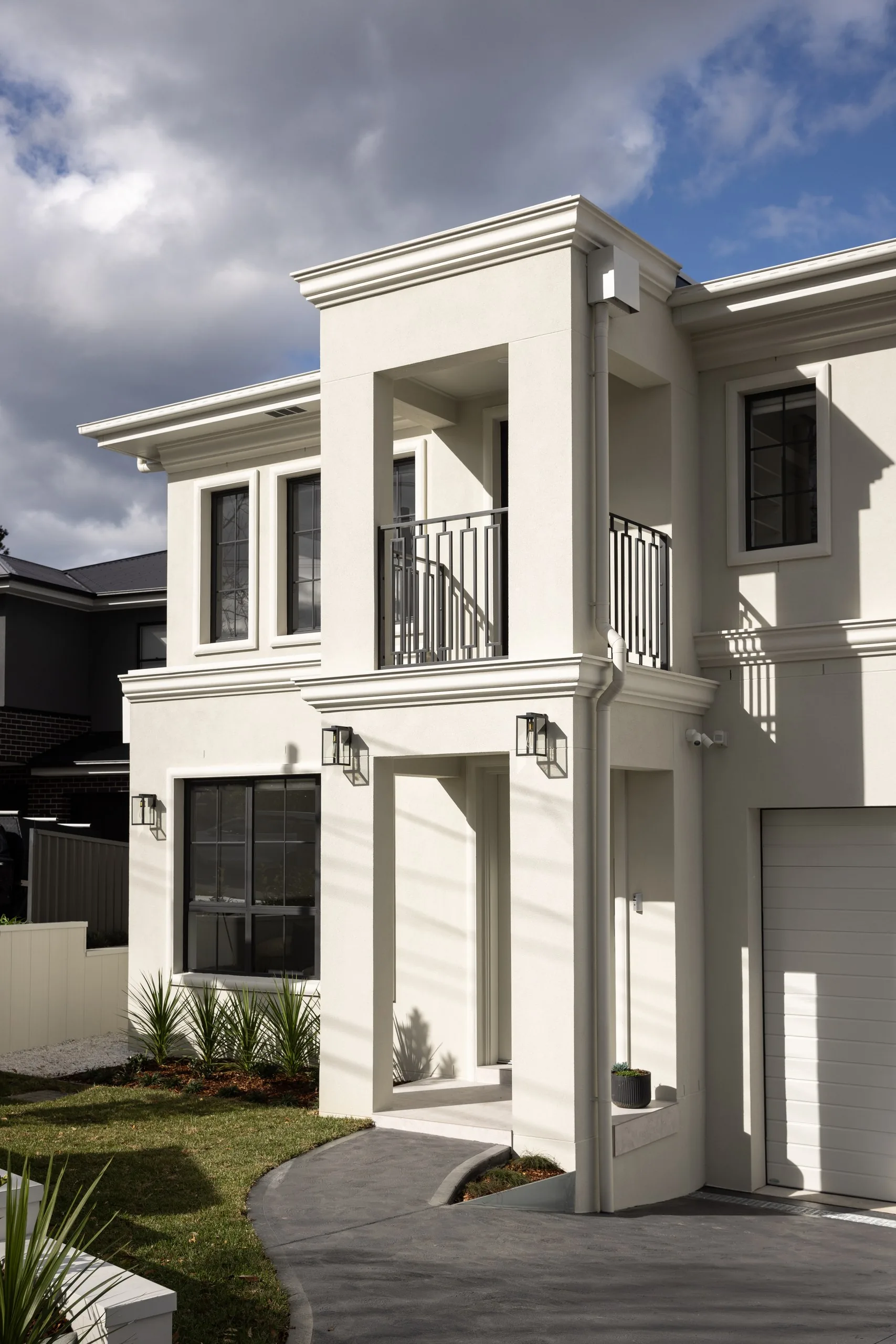 Entry and arched balcony detail, Westleigh custom home