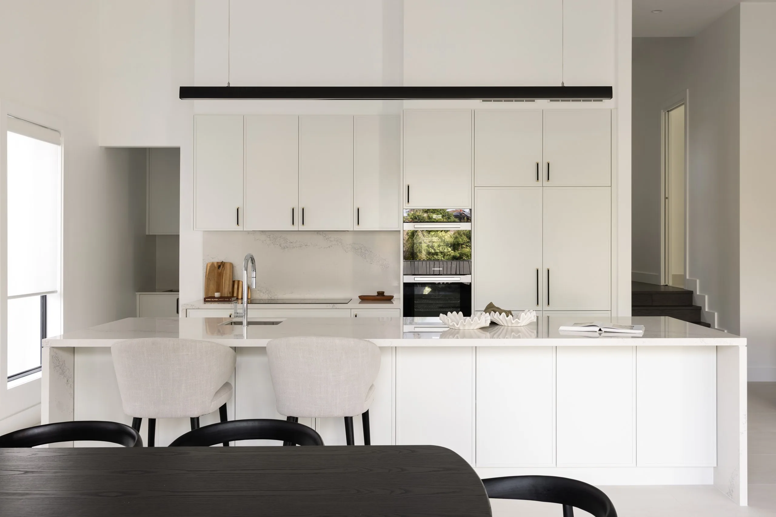 Kitchen island and dining space, Westleigh split-level home