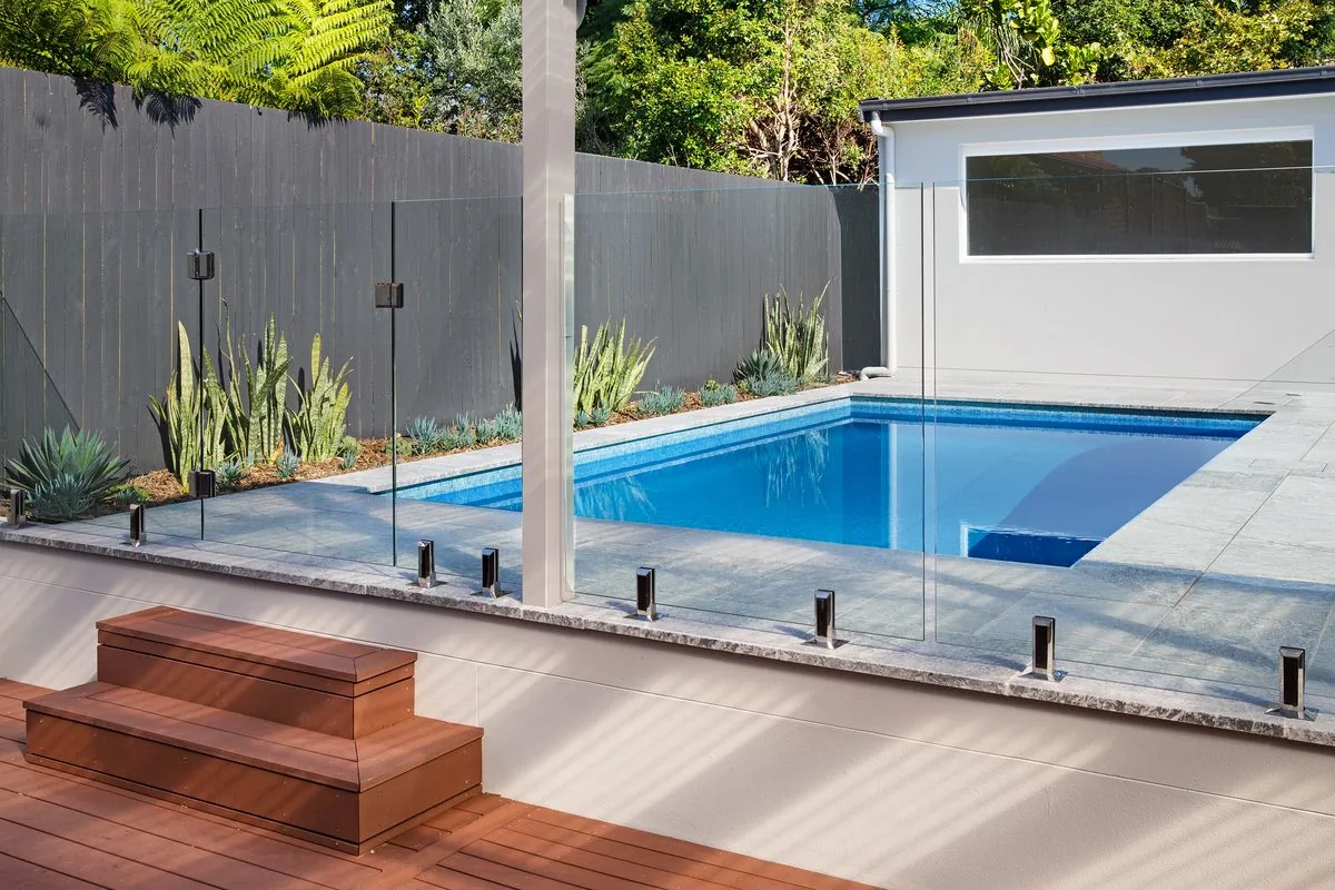 Concrete pool, glass fencing and converted gym-office pool house, Willoughby