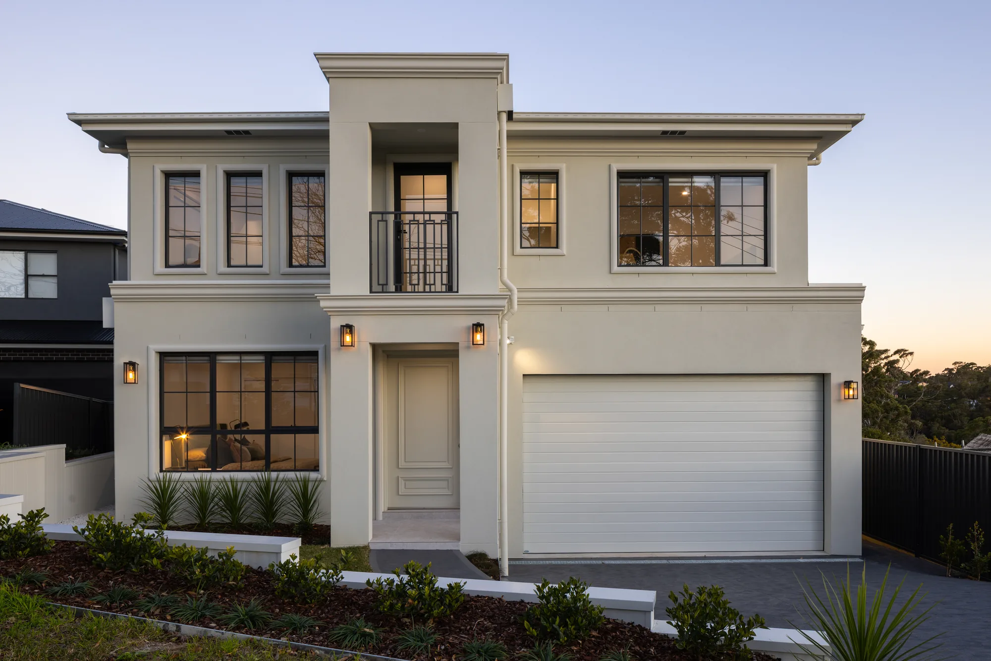 Split-level custom home with white rendered facade, Westleigh