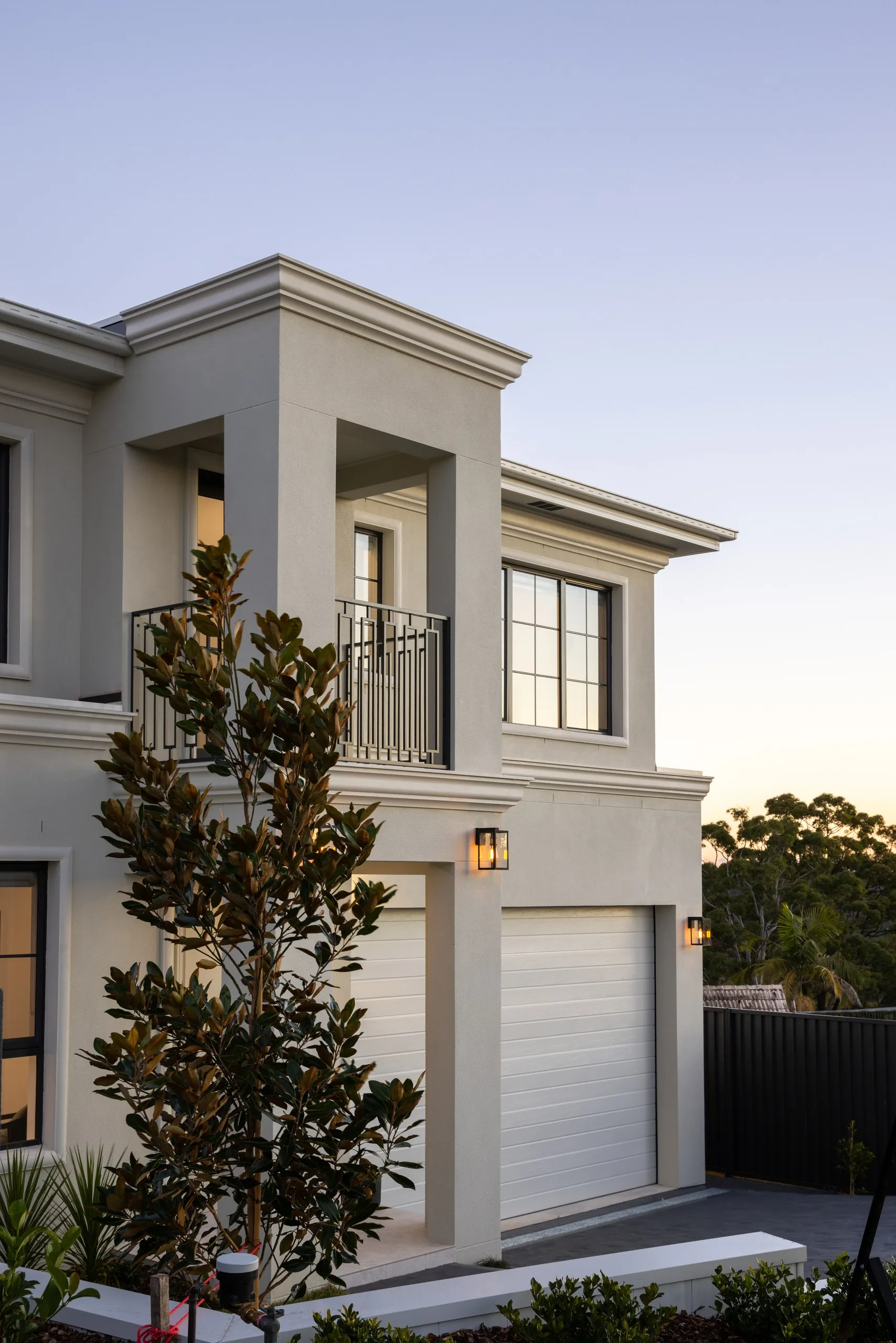 White rendered facade with feature tree, Westleigh custom home